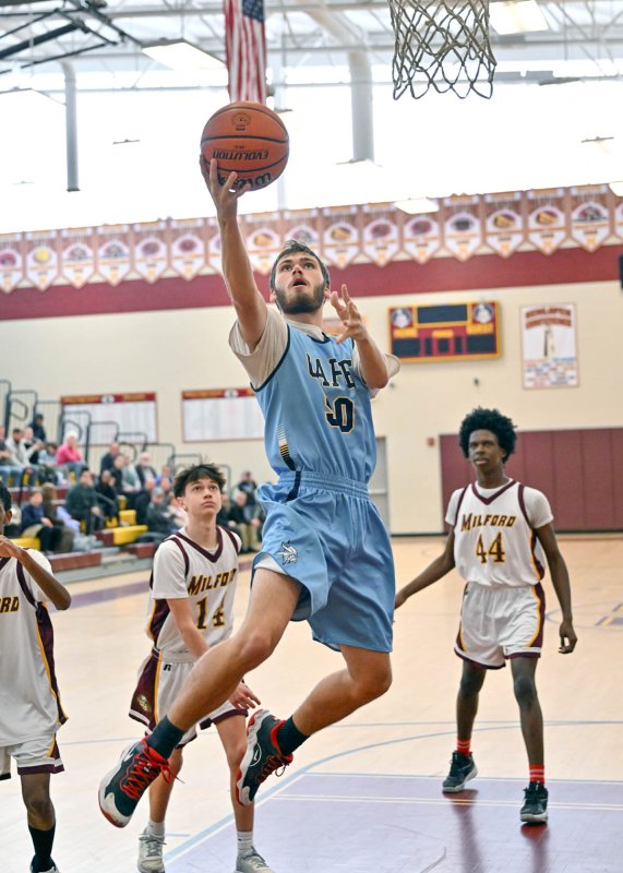 Cape junior Jaxon Benton glides in for a bucket.