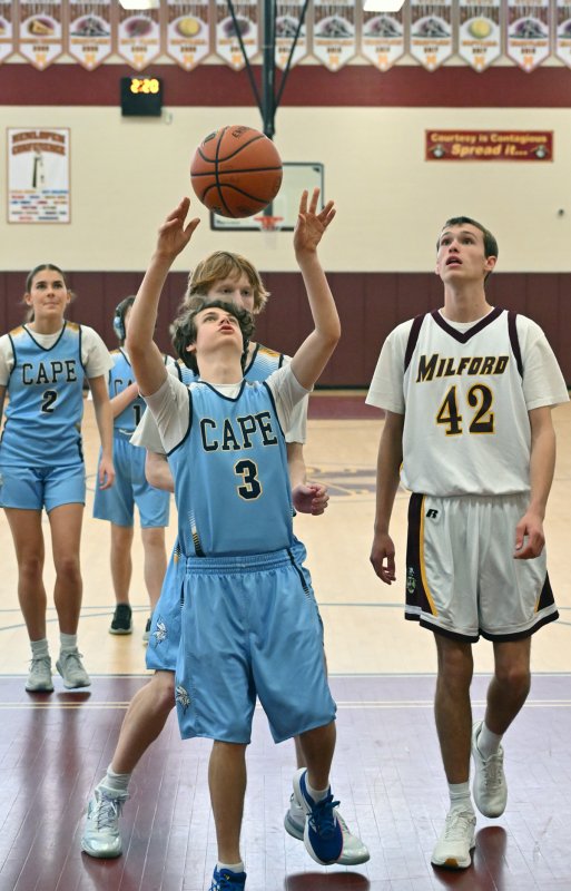 Xavier Zimmer shoots from underneath. He scored two points in the game.
