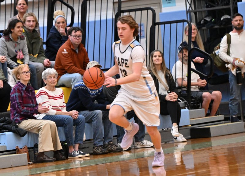 Junior Aidan Wyatt leads a Vikings fast break up the sideline.