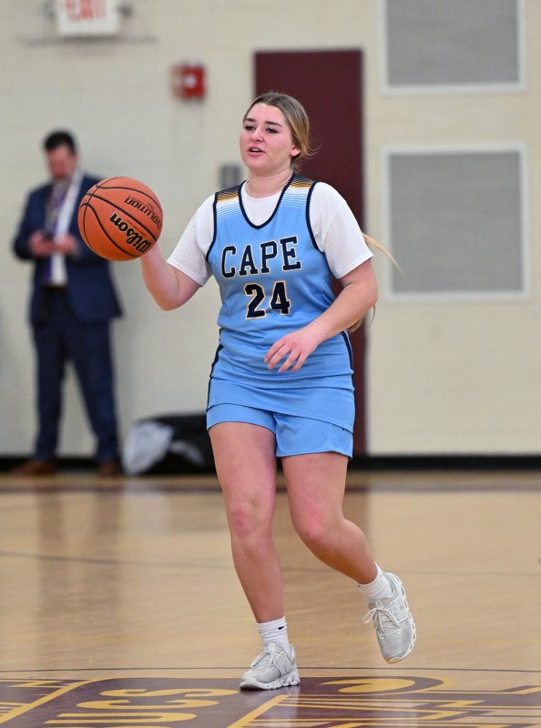 Junior unified partner Brynne Fox brigs the ball up for the Vikings.