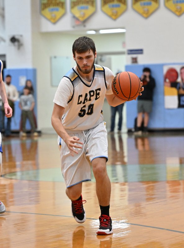 Junior Jaxon Benton drives to the paint for the Vikings.