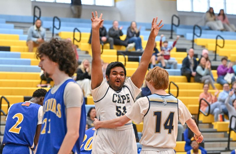 Cape sophomore Jwalit Patel celebrates with teammate Bennett Steinmann after making two of his team-leading six points. DAN COOK PHOTOS