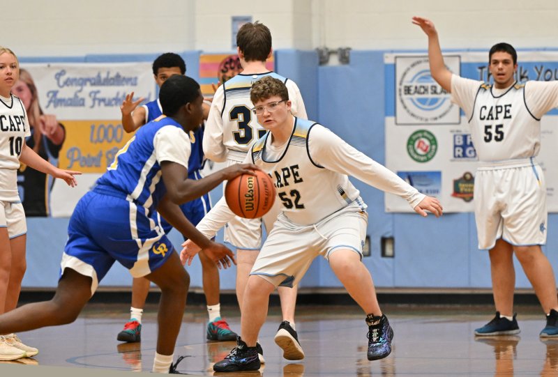 Cape junior Robert Harman-Strike plays close defense on Caesar Rodney’s Jacob Kamara.