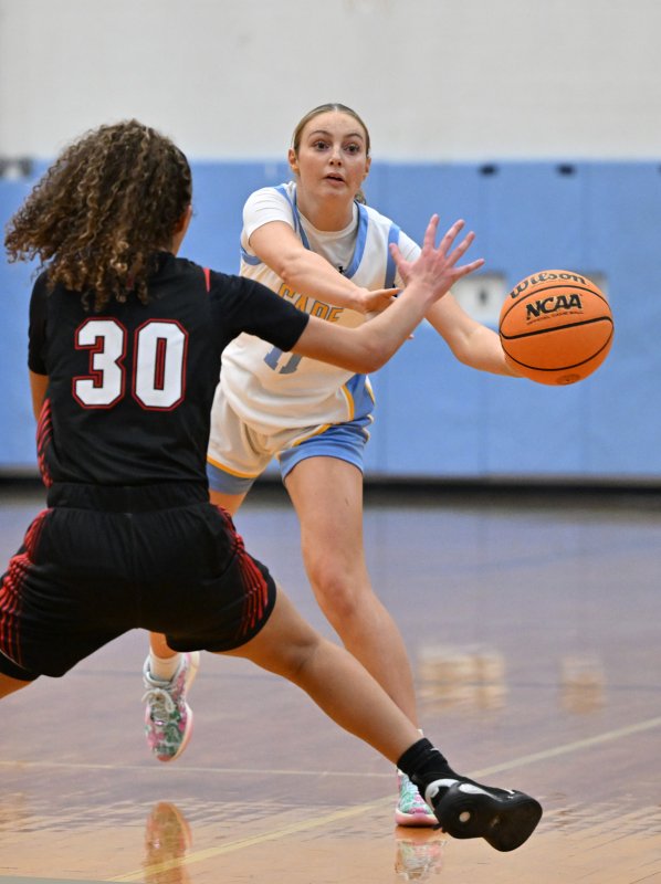 Senior Maya Yngve passes down low.