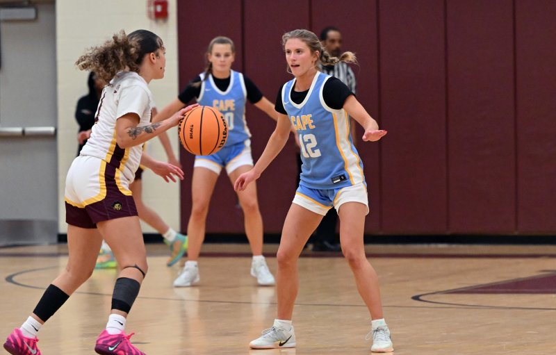 Cape junior Amara Fruchtman plays tough defense on Milford’s Tristen Showell.