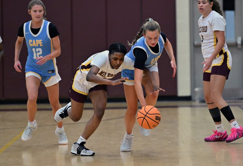 Ally Diehl gets a steal on Milford’s Amariah Satcher-Harris.
