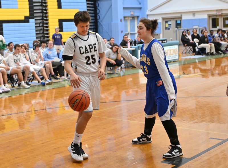 Cape sophomore Aiden Curran drives on CR’s Aiden Nilson.