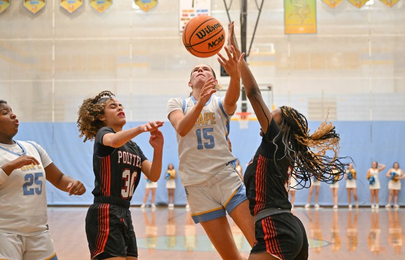 Cape senior Amalia Fruchtman splits the defense, puts up a deuce and gets the foul for an and-one opportunity. She scored 23 points in the victory. DAN COOK PHOTOS