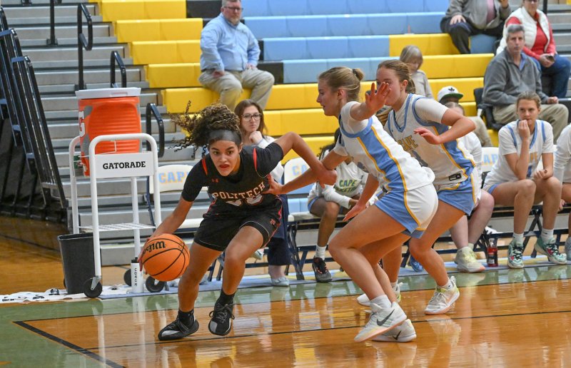 Polytech’s Sierra Henry drives baseline.