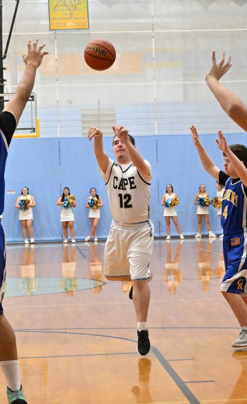 Sophomore Zackary Valles takes a shot in the paint for the Vikings.