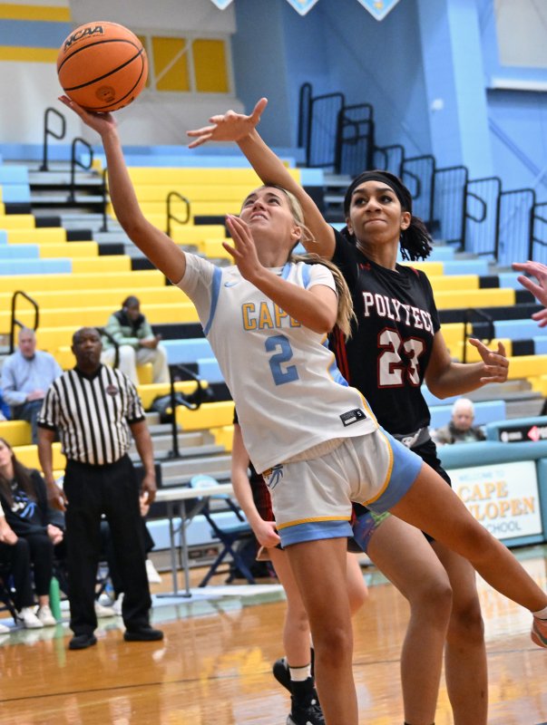 Cape sophomore Mikaela Gordon is fouled by Polytech’s Milan Hinnant.