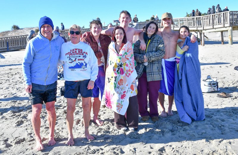 Longtime plunger Connie Miller has a long legacy of Polar Bears. Shown are (l-r) son JD Miller, Connie, Jack Wiggins, Bella Deblasio, Evan Jarrell, Julia Canto, Zane Miller and Avary Miller, who turned 18 at 12:02 a.m., Jan. 1. DAN COOK PHOTOS