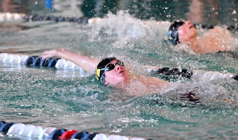 Milford sophomore Spencer Peel swims the backstroke for the Bucs.