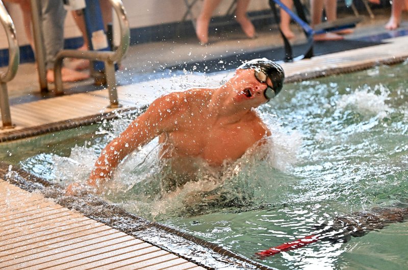 Senior Kyle Green makes the turn in the breast stroke.