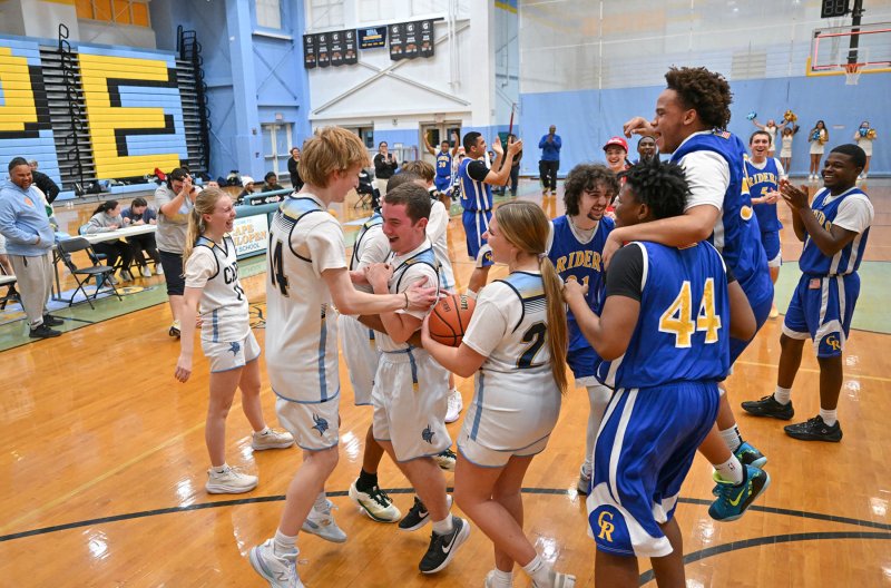 Both teams celebrate Cape sophomore Zackary Valles’ last-second shot.