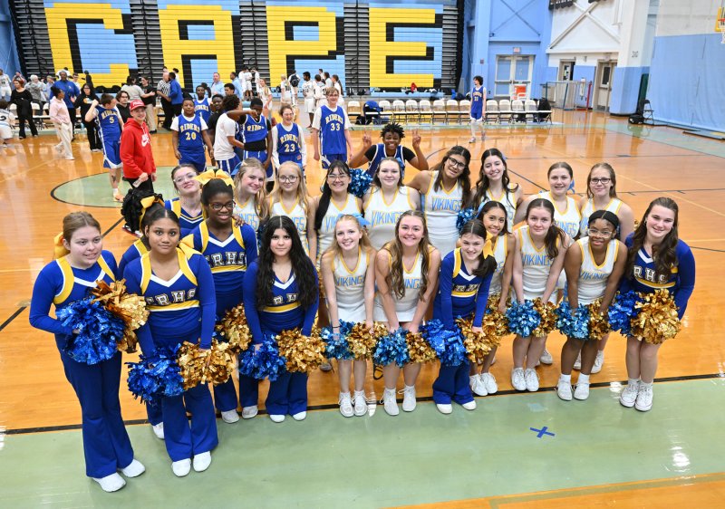 The Cape and Caesar Rodney cheerleaders pose together after the game.