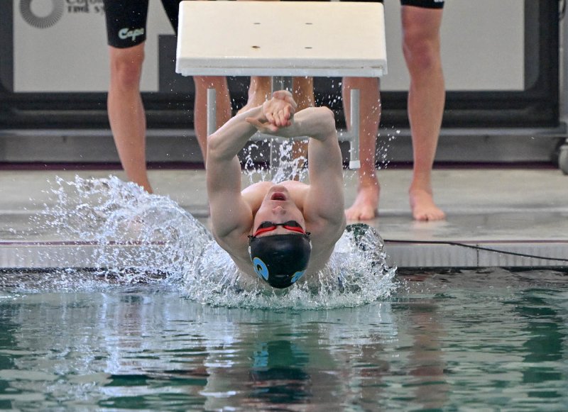 Cape sophomore Jack Bain leaves the blocks in the medley relay. DAN COOK PHOTOS