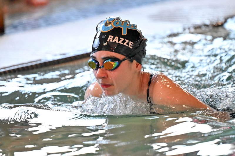 Senior Gianna Razze swims the breast stroke.