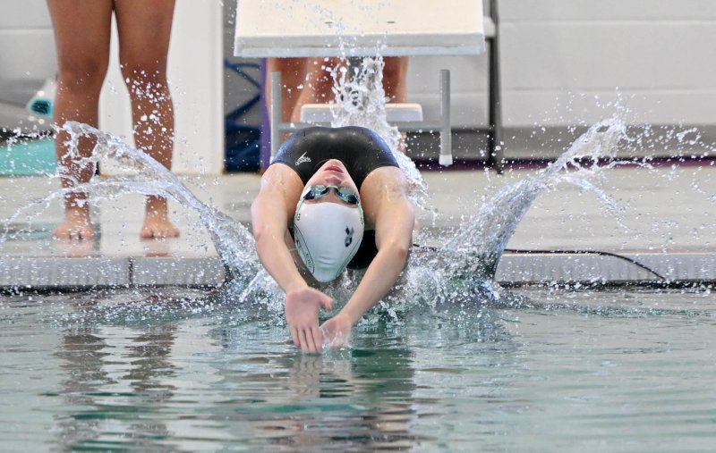 Sussex Academy senior Victoria Evans powers off the blocks in the 100 backstroke. She won the event with a time of 1:03.08.