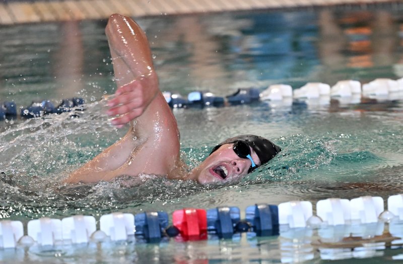 Freshman William Passo swims the free leg of the IM.