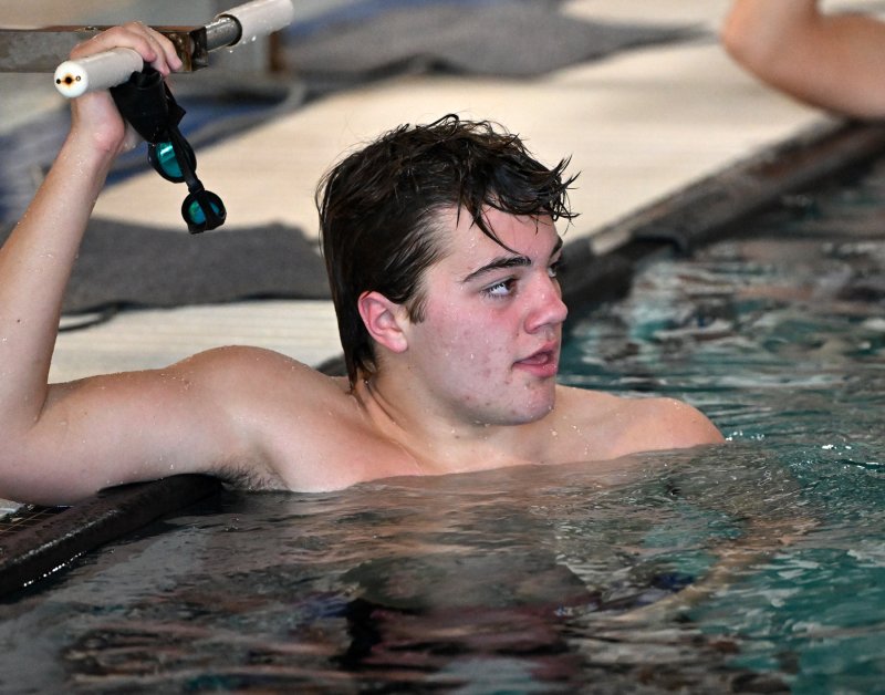 Cape sophomore Jaxen Edwards looks at the scoreboard after winning the 200 freestyle.