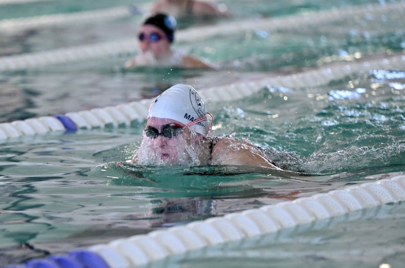 Sussex Academy sophomore Gretchen Maughan wins the 100 breast with a time of 1:08.23.