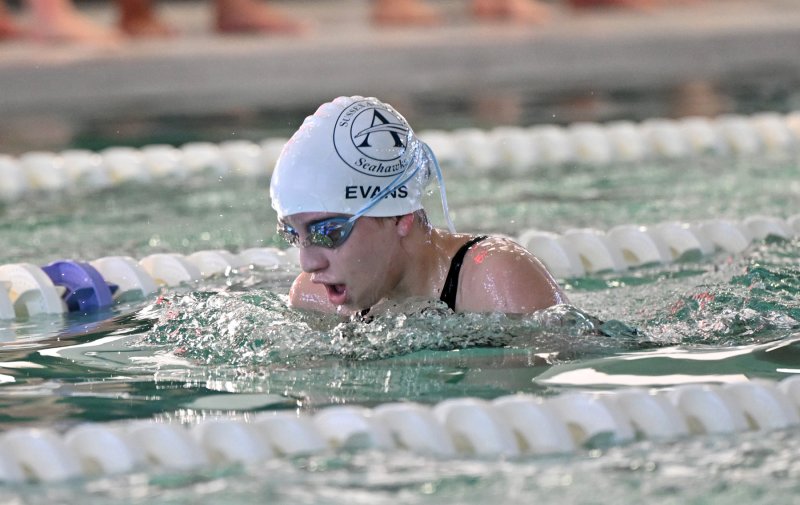 Sussex Academy eighth-grader Eliza Evans swims the 200 IM.