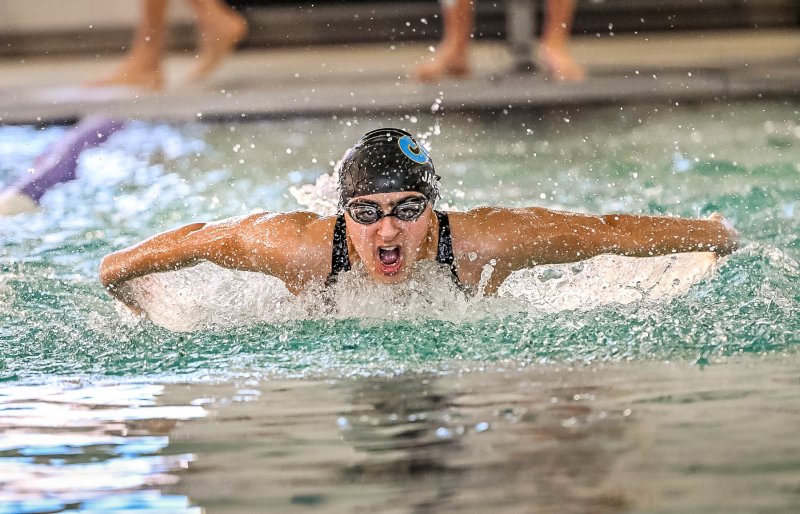 Cape junior Mia Jaoude wins the 100 fly with a time of 1:00.39.