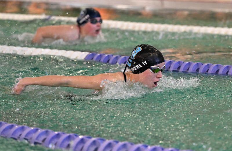 Cape sophomore Addison Freebery swims the fly leg of the medley relay.