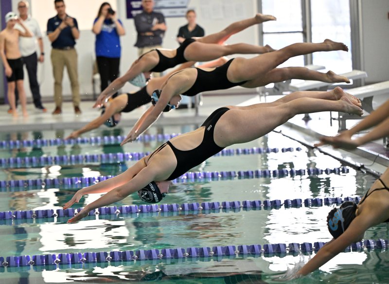 Sussex Academy junior Anna Mumford leaves the blocks in the 100 frees. She won the event with a time of 53.96.