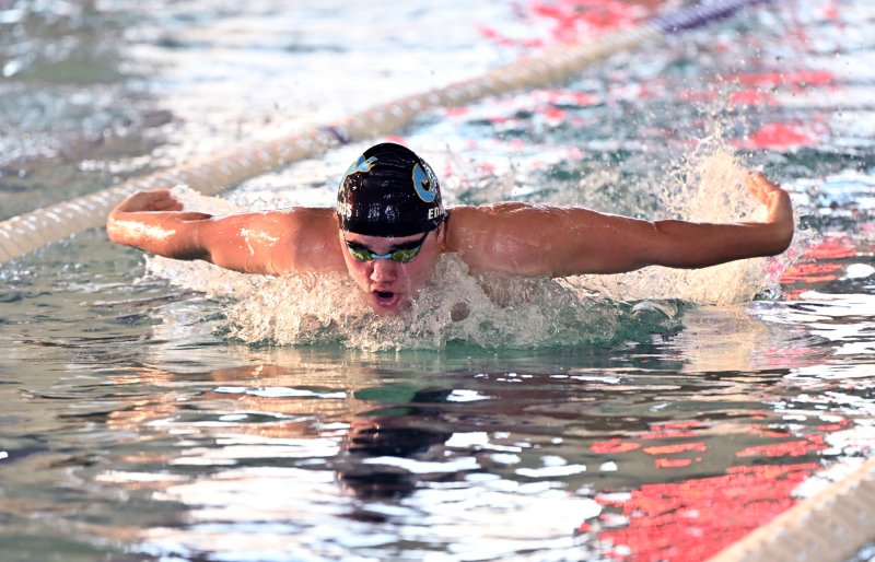 Cape sophomore Jaxen Edwards wins the 100 fly with a time of 54.27.