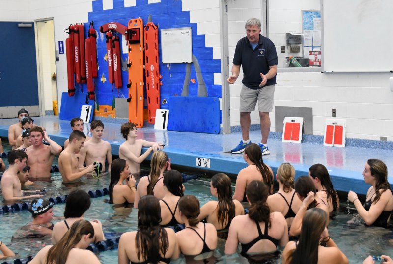 Cape head coach Bill Geppert gives last-minute instructions to his teams.