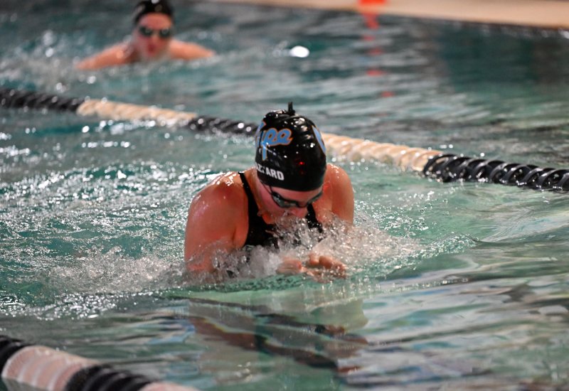 Hayden Hazzard swims the breaststroke leg of the medley relay.