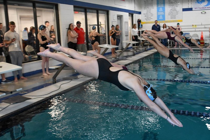 Cape senior Dilyla Rohls leaves the blocks in the 50 freestyle.