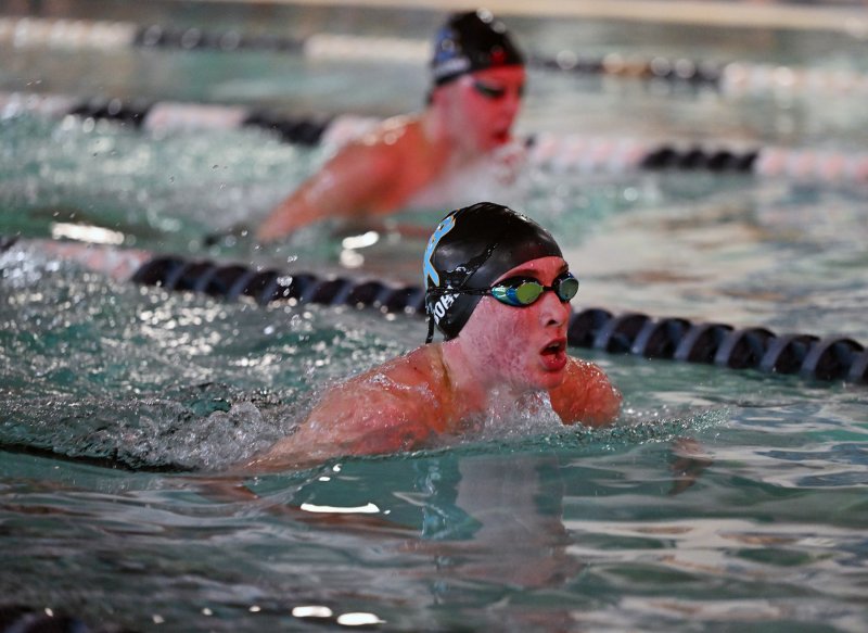 Junior Weston Bohl swims the breaststroke leg of the IM for the Vikings.