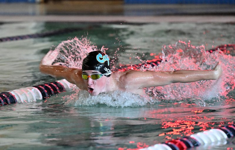 Cape junior Hugh Jack swims the fly leg of the winning medley relay squad.