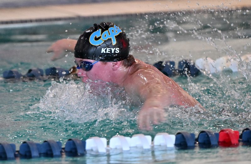 Senior John Keys swims the fly leg of the medley relay.