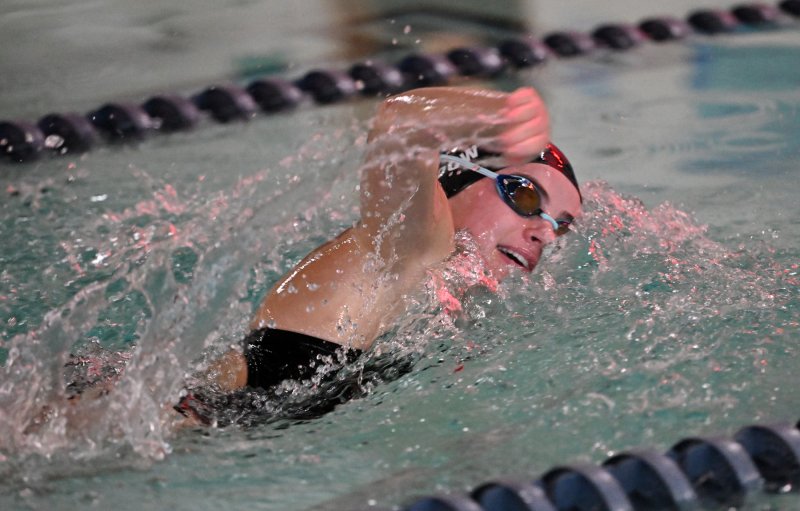 Cape junior Isla Touw wins the 100 free with a 1:03.10.