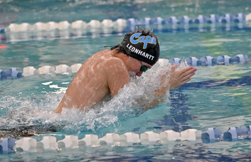 Cape senior Brooks Leonhartt swims the breaststroke leg of the winning medley relay.