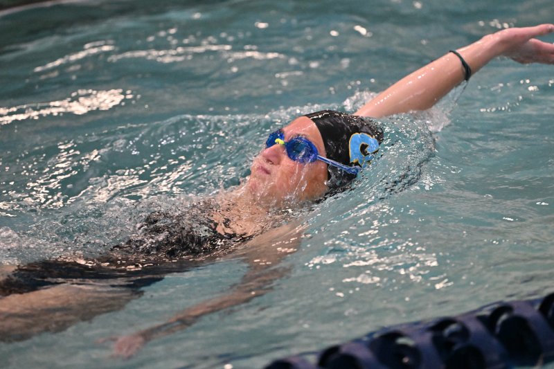 Freshman Sara Caldwell swims the individual medley.