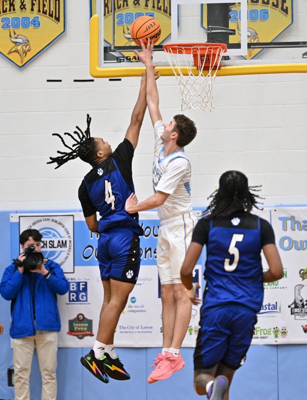 Cape senior Braxton Figgs makes one of his four blocks in the game.
