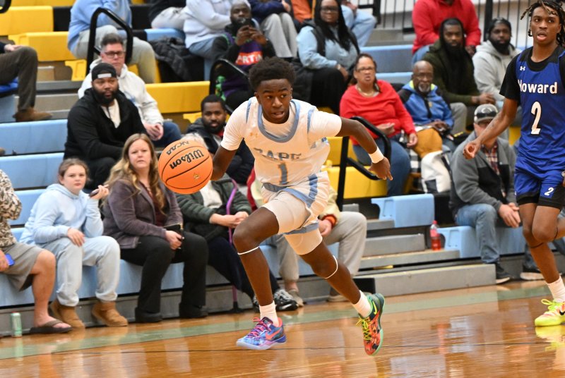Junior point guard Stephen Sivels speeds the ball up the court on a fast break.