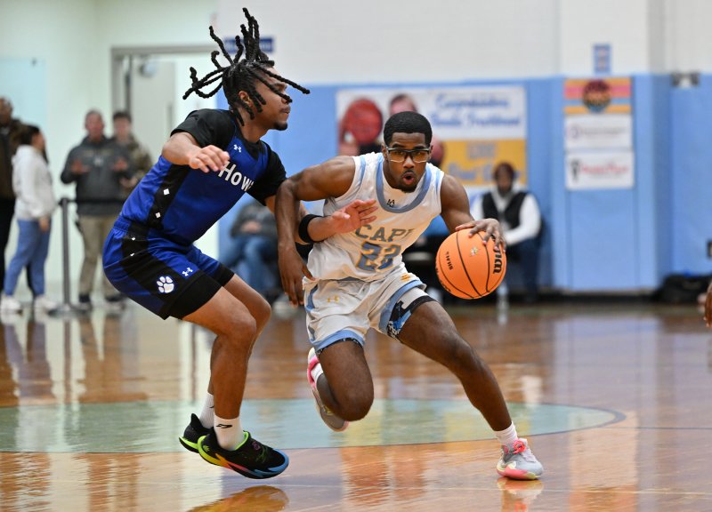 Cape’s Oz Batson makes a hair-raising move on Howard’s Bryson Lane.