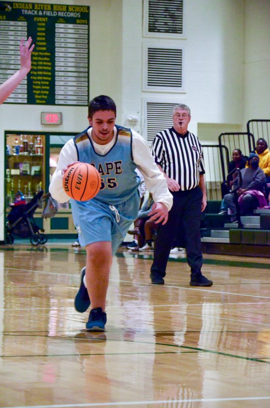 Vikings junior Austin Hastings races down the court.
