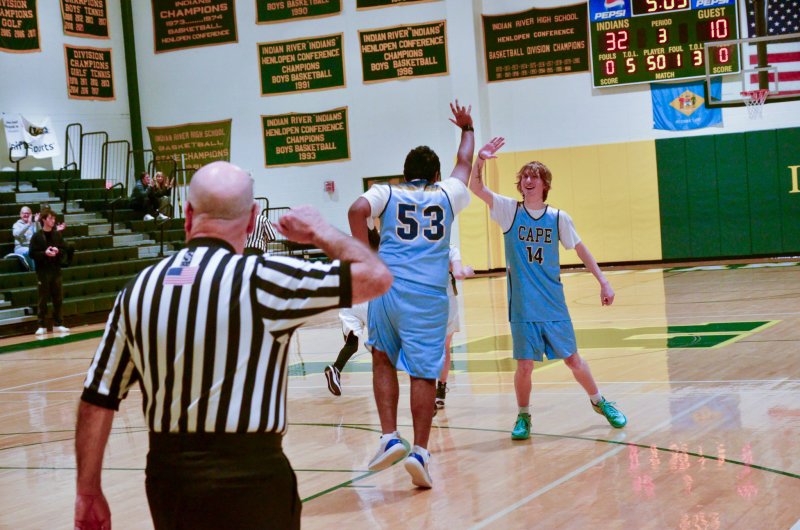Cape sophomore Jwalit Patel is congratulated by Bennett Steinmann after one of his three buckets.