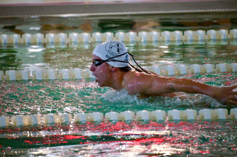 Sussex Academy freshman Kaleb Siok catches his breath in the butterfly.