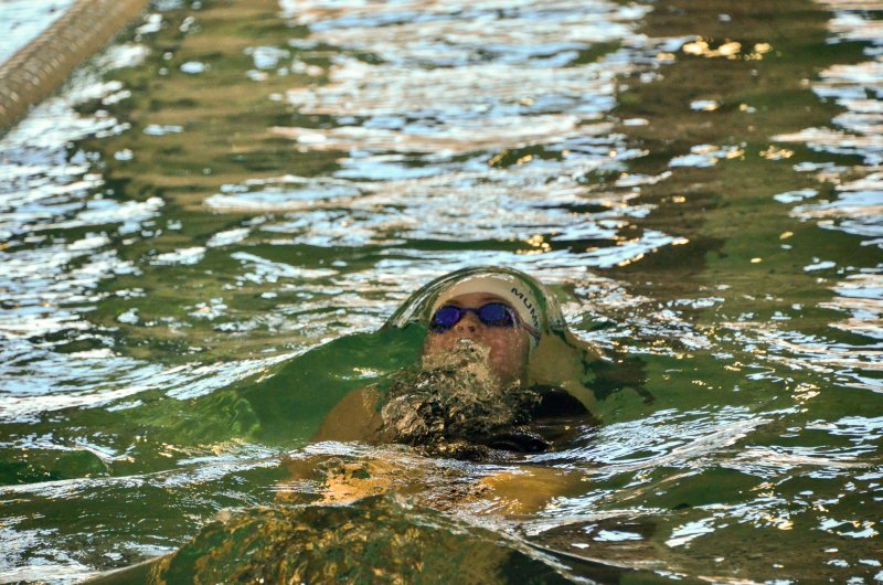 Seahawks junior Anna Mumford breaks the surface during the backstroke leg of the medley.