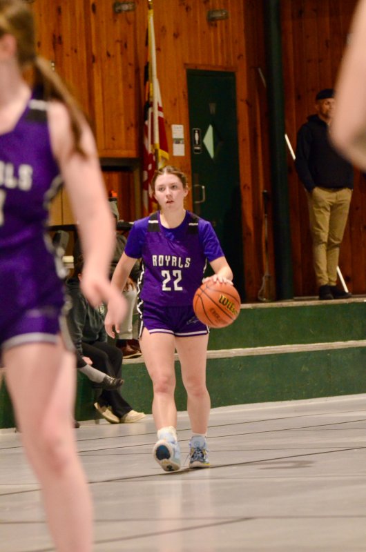 Royals sophomore Avery McCoy brings the ball up.