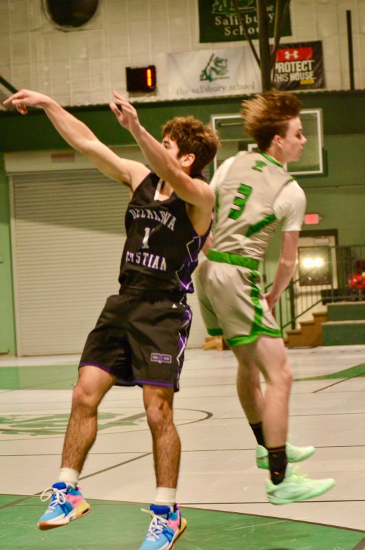 Royals junior Isaiah McCluskey beats the shot clock and a block for two points.