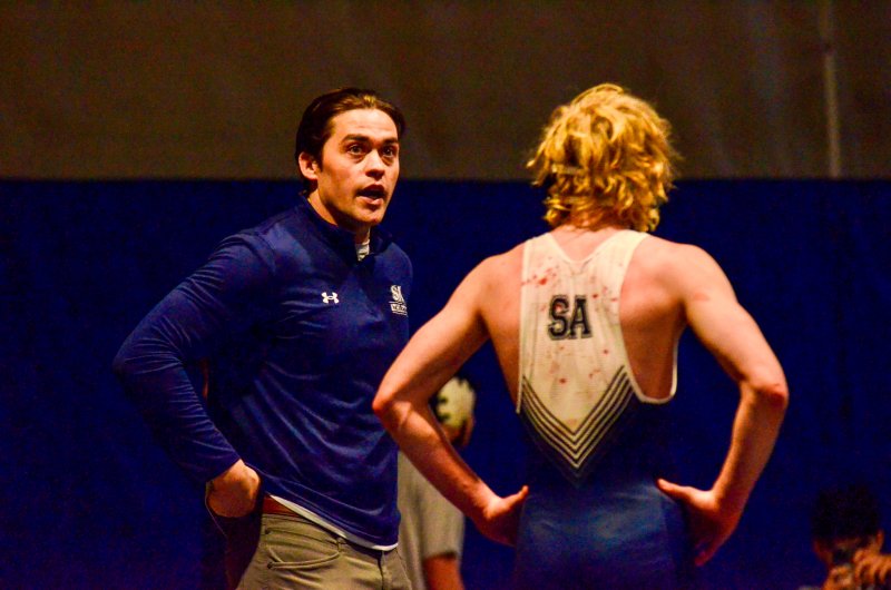Seahawks coach Cory Lawson talks to Mason Shade during a blood break.